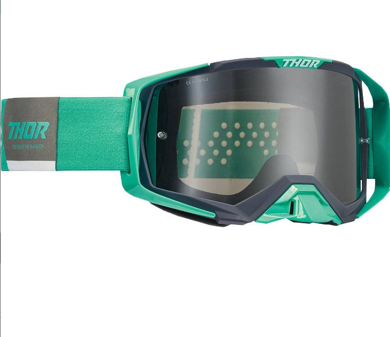 thor teal goggles with grey tinted lenses, grey and teal strap with teal logo