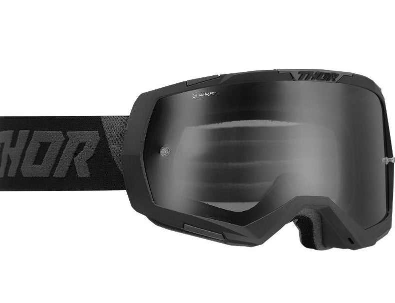 black thor goggles with tinted lens, black strap, and black logo