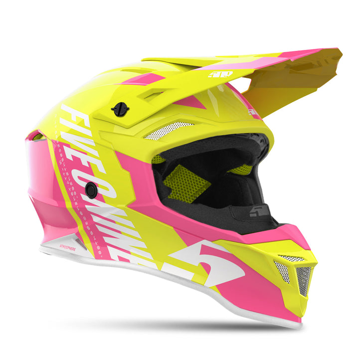 Yellow and pink motocross helmet with white branding on a white background